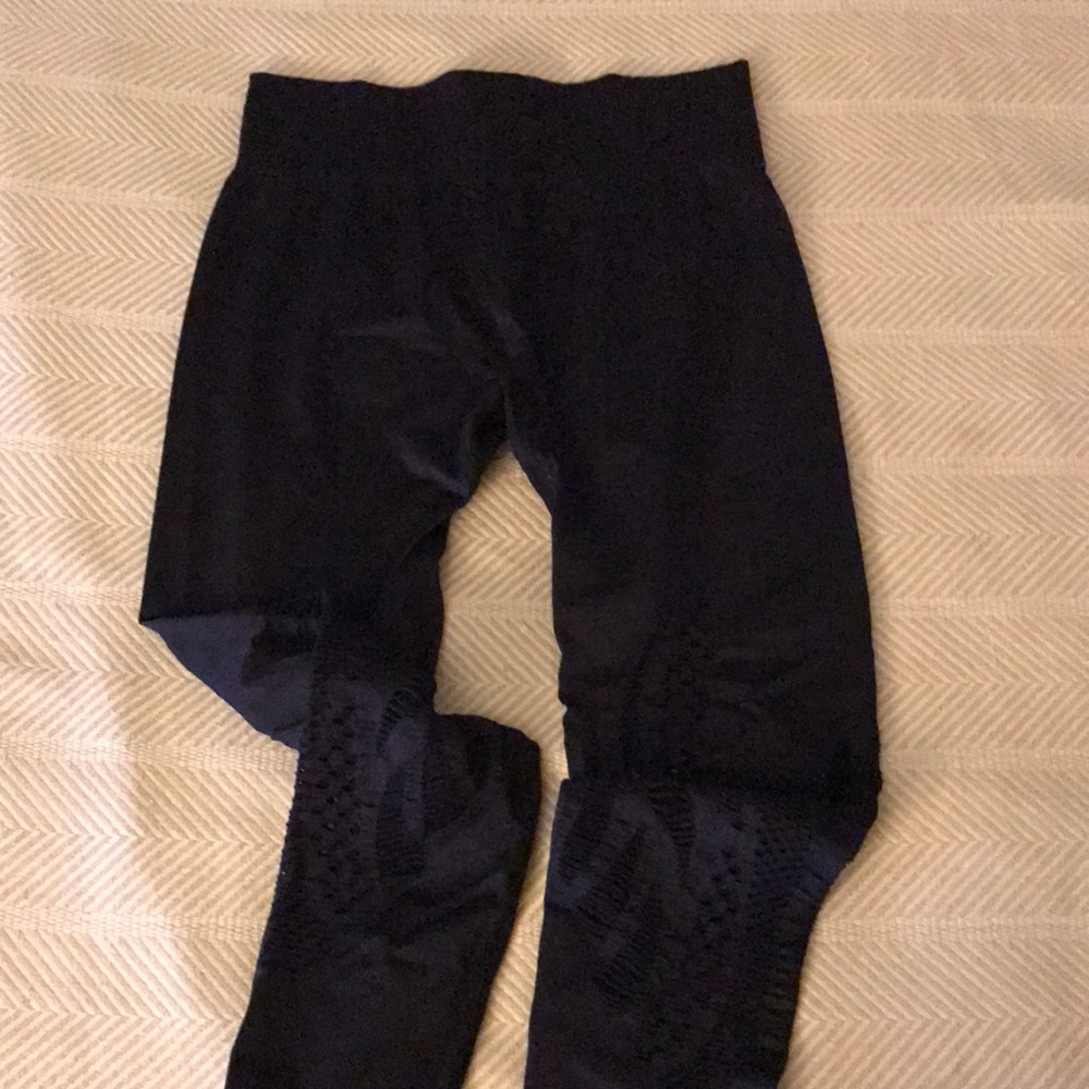 Fabletics midrise leggings with lower leg decorative cutouts. Size Small